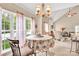 Bright breakfast nook with large windows, pendant lighting, and comfortable seating at 141 Ivy Creek Ln, Mooresville, NC 28115