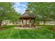 Charming community gazebo surrounded by lush greenery, offering a tranquil retreat at 141 Ivy Creek Ln, Mooresville, NC 28115