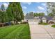 Charming home with two-car garage, manicured lawn, and inviting curb appeal at 141 Ivy Creek Ln, Mooresville, NC 28115