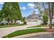Beautiful home featuring a two-car garage, well-maintained lawn, and mature landscaping at 141 Ivy Creek Ln, Mooresville, NC 28115