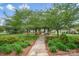 Charming gazebo surrounded by lush greenery providing a serene outdoor gathering space at 141 Ivy Creek Ln, Mooresville, NC 28115