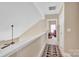 Upstairs hallway with high ceilings featuring fresh paint and carpeted floors at 141 Ivy Creek Ln, Mooresville, NC 28115