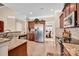 Kitchen with stainless steel appliances, granite counters, and convenient access to the dining area at 141 Ivy Creek Ln, Mooresville, NC 28115