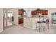 Cozy kitchen featuring bar stool seating, breakfast bar, stainless appliances, and natural light at 141 Ivy Creek Ln, Mooresville, NC 28115