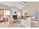 Bright living room boasts a fireplace, ceiling fan, and lots of natural light at 141 Ivy Creek Ln, Mooresville, NC 28115