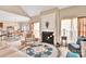 Comfortable living space with a fireplace, large windows, and an open floor plan at 141 Ivy Creek Ln, Mooresville, NC 28115