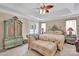 Inviting main bedroom with a tray ceiling, French doors, and elegant furnishings at 141 Ivy Creek Ln, Mooresville, NC 28115