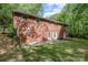 Brick home featuring a spacious backyard with a patio, perfect for outdoor entertaining and relaxation at 1444 Harris St, Statesville, NC 28677