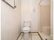 Basic bathroom featuring a standard toilet, a shower, and minimal fixtures for a functional space at 1444 Harris St, Statesville, NC 28677