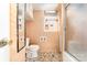 Compact bathroom with a toilet, shower, and simple fixtures, offering a basic and functional design at 1444 Harris St, Statesville, NC 28677