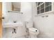 Small bathroom featuring a classic white sink and toilet at 1444 Harris St, Statesville, NC 28677