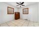 Bright bedroom with light walls, wood trim windows, and vintage furniture at 1444 Harris St, Statesville, NC 28677