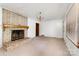 Bright living room with brick fireplace, chandelier, and natural light at 1444 Harris St, Statesville, NC 28677