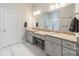 Bathroom features double vanities with granite countertops, and a tiled shower at 15133 Rocky Bluff Loop, Davidson, NC 28036