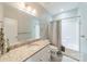 Bathroom featuring a granite vanity, toilet, shower, and tiled floors at 15133 Rocky Bluff Loop, Davidson, NC 28036
