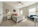 Bright bedroom with a ceiling fan, cozy seating area, and neutral decor at 15133 Rocky Bluff Loop, Davidson, NC 28036