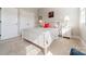 Bright bedroom featuring carpeted floors, ample lighting, and minimalist decor at 15133 Rocky Bluff Loop, Davidson, NC 28036