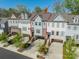 Charming townhome with brick accents, attached garage, and well-manicured landscaping at 15133 Rocky Bluff Loop, Davidson, NC 28036