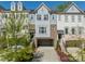 Charming townhome showcasing a blend of brick and siding, with a convenient two-car garage at 15133 Rocky Bluff Loop, Davidson, NC 28036