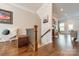Foyer featuring wood floors, wood banister, and natural light at 15133 Rocky Bluff Loop, Davidson, NC 28036