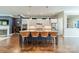Stylish kitchen features a large island with seating, stainless appliances, and ample cabinet space at 15133 Rocky Bluff Loop, Davidson, NC 28036