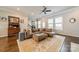Cozy living room with a sectional sofa, ottoman, and large area rug at 15133 Rocky Bluff Loop, Davidson, NC 28036