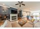 Spacious living room connected to the kitchen and dining area, featuring a fireplace at 15133 Rocky Bluff Loop, Davidson, NC 28036