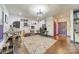 Open office space features multiple workstations, modern lighting, hardwood floors, and a floral area rug at 15133 Rocky Bluff Loop, Davidson, NC 28036