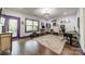 Spacious office features hardwood floors, bright window, modern light fixture and vibrant floral rug at 15133 Rocky Bluff Loop, Davidson, NC 28036