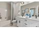 Bright bathroom with double sink vanity, tub/shower combo, and modern finishes at 167 Glenn Dr, Mooresville, NC 28115