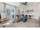 Versatile bonus room with seating, desks, and natural light, perfect for work or play at 167 Glenn Dr, Mooresville, NC 28115
