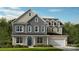 New construction home featuring vertical siding, brick accents, a covered entryway, and an attached two-car garage at 167 Glenn Dr, Mooresville, NC 28115