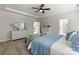 Spacious main bedroom with tray ceiling, neutral decor, and comfortable seating area at 167 Glenn Dr, Mooresville, NC 28115