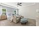 Bright main bedroom featuring large windows, sitting area, and stylish decor at 167 Glenn Dr, Mooresville, NC 28115