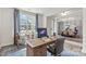 Bright home office with desk, chairs, large windows, and access to the dining room with seating for six at 167 Glenn Dr, Mooresville, NC 28115