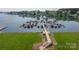 Aerial view of the marina with multiple boat slips and a wooden walkway on a bright, sunny day at 18700 Nautical Dr # 101, Cornelius, NC 28031