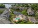 Aerial view showcasing a pool, waterfront, and community amenities at 18700 Nautical Dr # 101, Cornelius, NC 28031