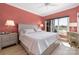 Serene bedroom with natural light, complemented by elegant lamps and a comfortable bed at 18700 Nautical Dr # 101, Cornelius, NC 28031