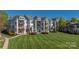 Multi-story condo features a large lawn with mature landscaping and private balconies in a desirable community setting at 18700 Nautical Dr # 101, Cornelius, NC 28031