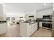 Open kitchen features modern appliances, beautiful countertops and a breakfast bar at 18700 Nautical Dr # 101, Cornelius, NC 28031