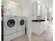Well-equipped laundry room with modern washer and dryer, plus storage at 18700 Nautical Dr # 101, Cornelius, NC 28031