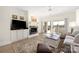 Well-lit living room features built-ins, a fireplace, and sliding glass doors to the outside at 18700 Nautical Dr # 101, Cornelius, NC 28031
