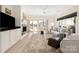 Bright living room with fireplace, hardwood floors, and sliding doors leading to outdoor patio at 18700 Nautical Dr # 101, Cornelius, NC 28031
