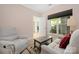Cozy living room with recliner, comfortable sofa, and view of nature through the window at 18700 Nautical Dr # 101, Cornelius, NC 28031