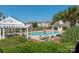 Enjoy the community pool with a pergola, lounging area, and clubhouse, perfect for relaxing and socializing outdoors at 18700 Nautical Dr # 101, Cornelius, NC 28031