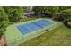 Overhead view of a fenced tennis court providing a recreational amenity for active residents at 18700 Nautical Dr # 101, Cornelius, NC 28031