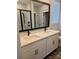 Bathroom featuring double sinks, quartz countertop, and a glass-enclosed shower at 1921 Hendricks St, Rock Hill, SC 29732