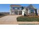 Charming two-story home with stone accents, attached garage, and well-manicured lawn at 2069 Fordhill St, Rock Hill, SC 29732