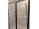 Shower with white marble tiles, black trim, and a rainfall shower head at 2069 Fordhill St, Rock Hill, SC 29732