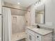 The bathroom has tile shower, and a white vanity with a granite countertop at 207 Blythe Mill Rd, Waxhaw, NC 28173